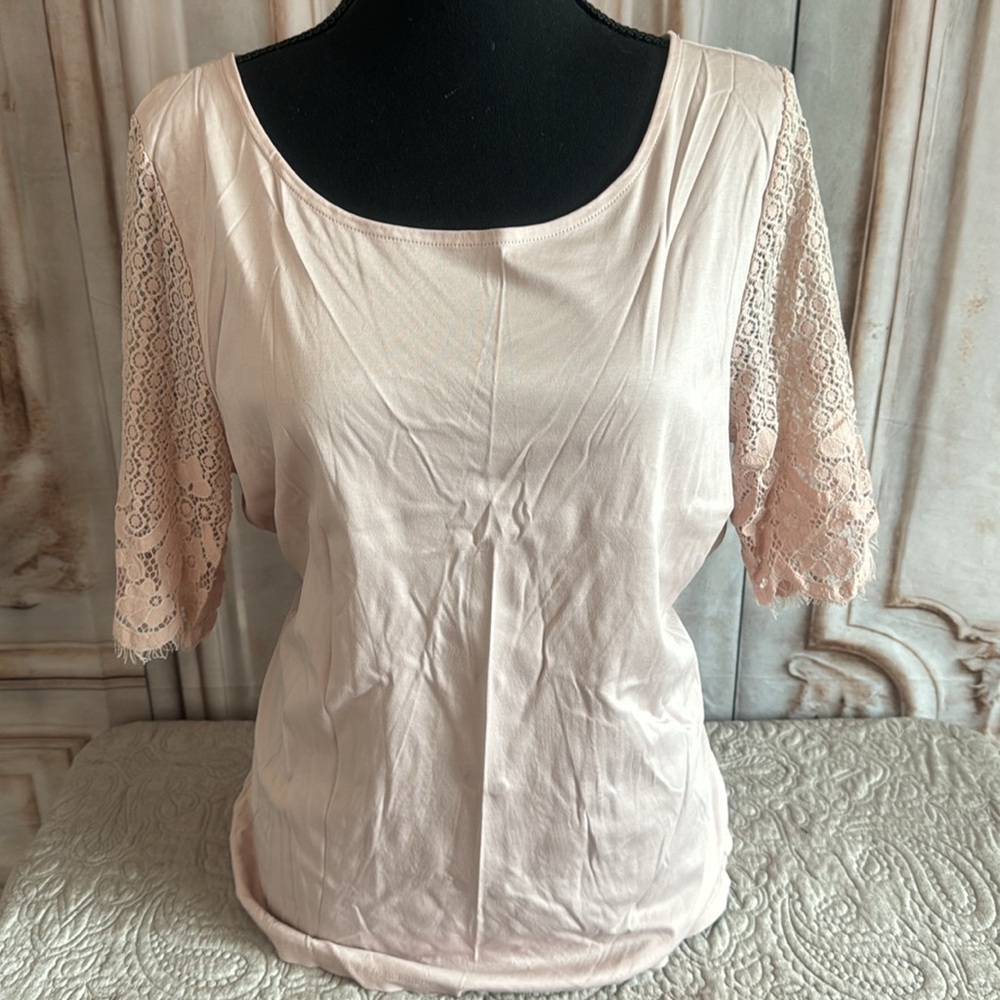 Beautiful blush rose colored top with lace sleeves.